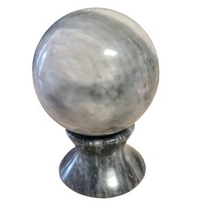Gray and white marble sphere with base